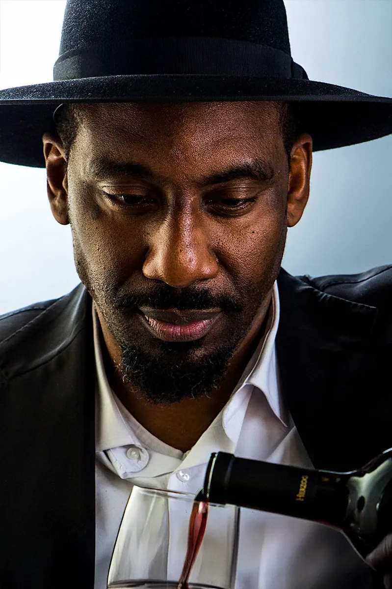Closeup of Amar'e Stoudmire pouring wine